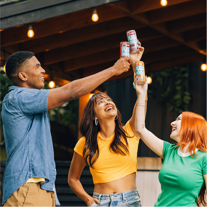 People toasting with Pura Soda